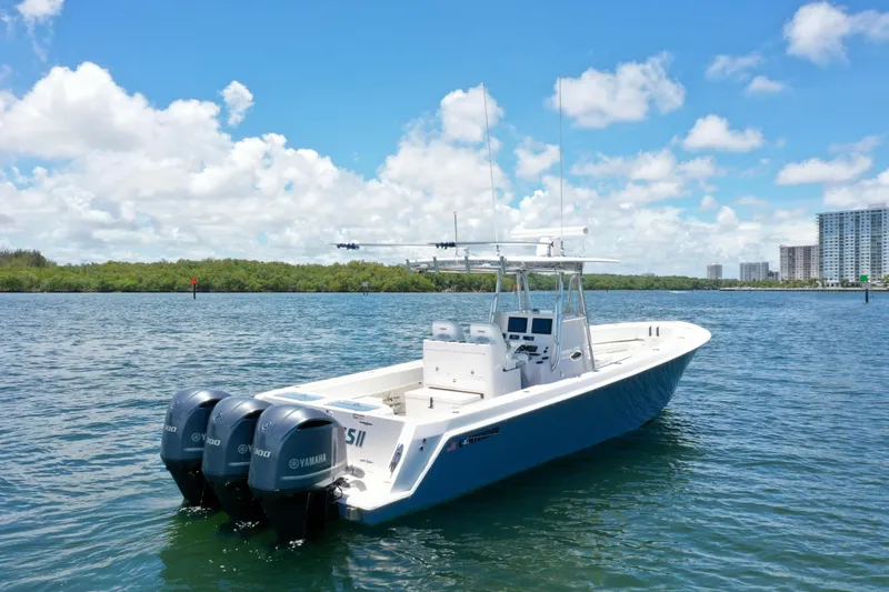 Relentless II W/ Seakeeper Yacht Photos Pics 2017 Contender 35 ST boat with triple Yamaha engines on a sunny day.