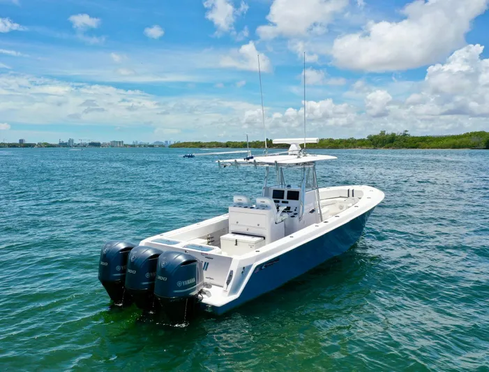 Relentless II W/ Seakeeper Yacht Photos Pics 2017 Contender 35 ST boat with triple Yamaha engines on open water.