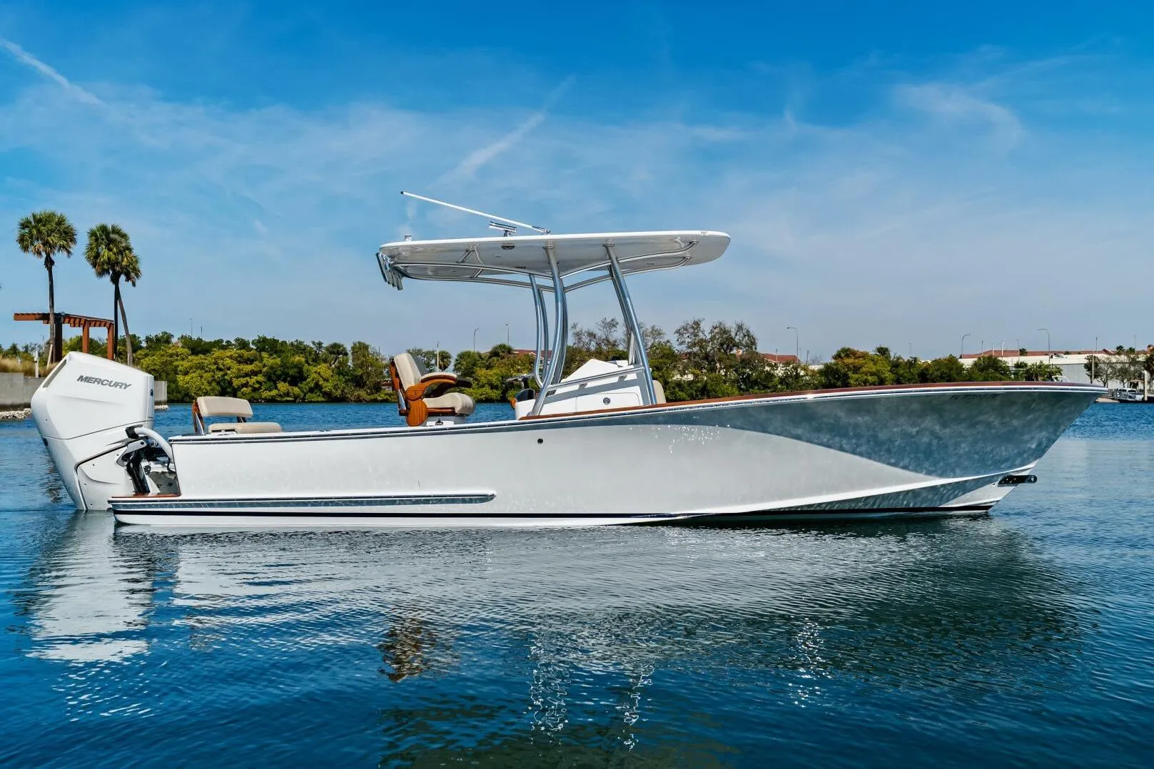 2024 Custom Center Console High Ground Boatworks on calm water, featuring sleek design and Mercury engine.