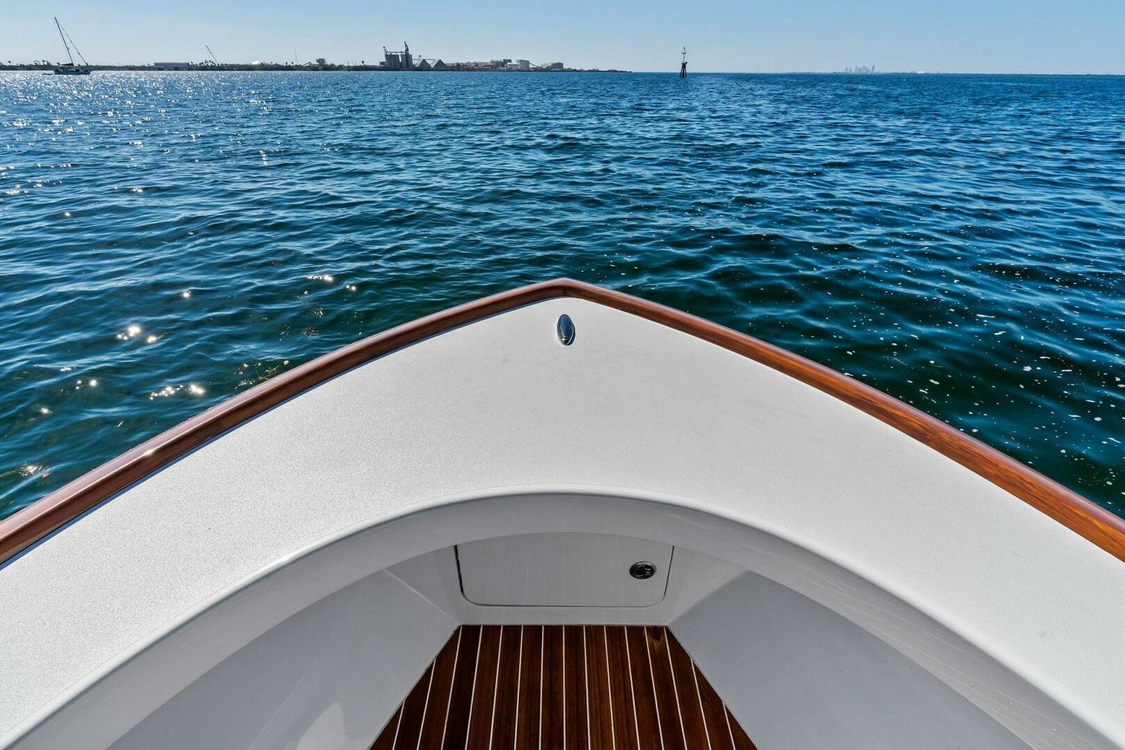 Bow of 2024 Custom Center Console High Ground Boatworks on open water.