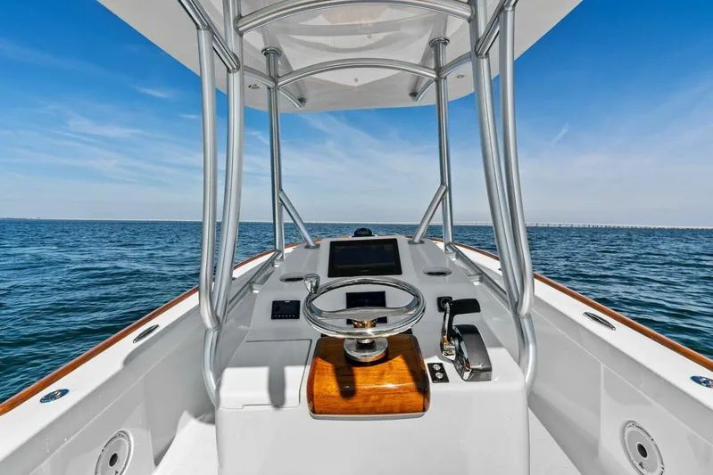  Yacht Photos Pics 2024 Custom Center Console High Ground Boatworks on open water, featuring sleek design and modern controls.