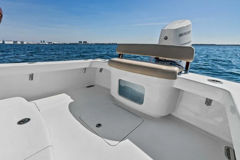  Yacht Photos Pics 2024 Custom Center Console High Ground Boatworks on open water, featuring spacious seating and Mercury engine.