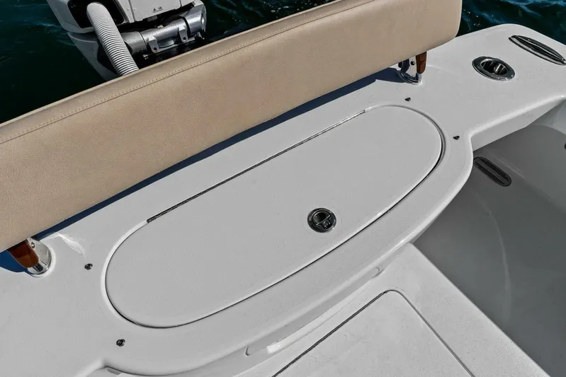  Yacht Photos Pics 2024 Custom Center Console High Ground Boatworks with cushioned seating and storage compartment.