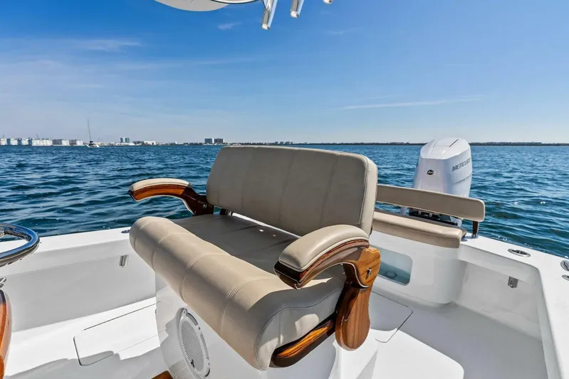  Yacht Photos Pics 2024 Custom Center Console High Ground Boatworks on open water, featuring luxurious seating.