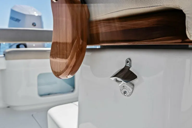  Yacht Photos Pics 2024 Custom Center Console High Ground Boatworks with wooden accents and bottle opener.