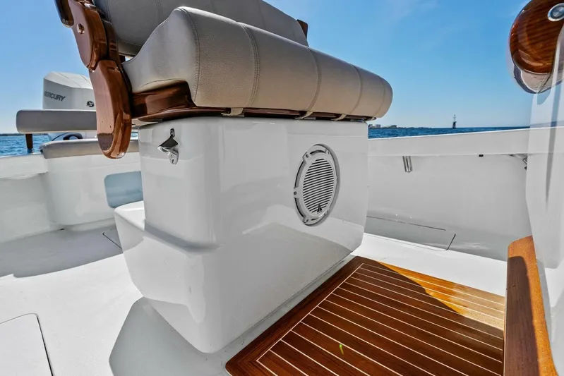  Yacht Photos Pics 2024 Custom Center Console High Ground Boatworks with cushioned seating and wooden deck detail.