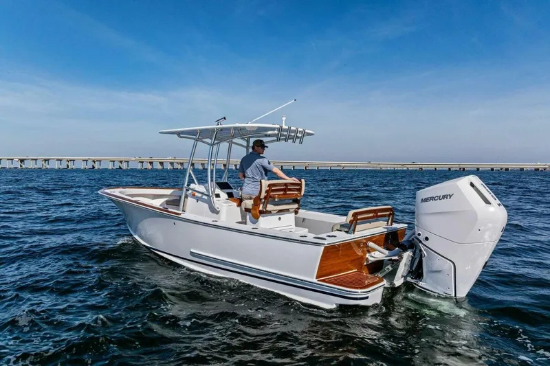  Yacht Photos Pics 2024 Custom Center Console High Ground Boatworks on open water, featuring Mercury outboard engine.