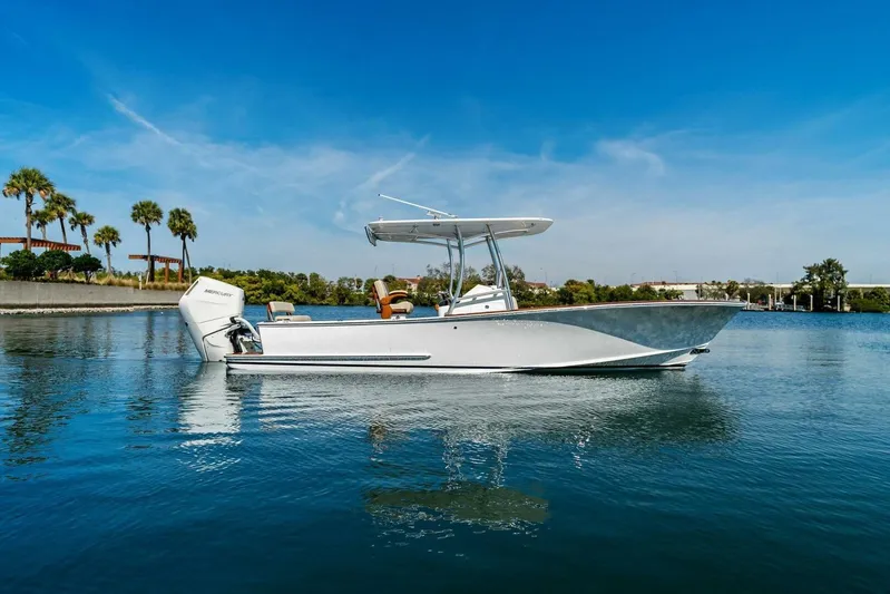  Yacht Photos Pics 2024 Custom Center Console High Ground Boatworks on calm water, clear sky background.
