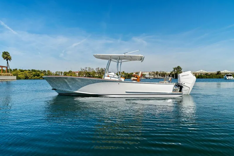  Yacht Photos Pics 2024 Custom Center Console High Ground Boatworks on calm water, clear sky background.