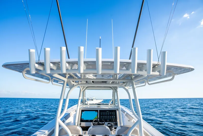  Yacht Photos Pics 2024 Yellowfin 39 boat on open sea with clear blue sky.