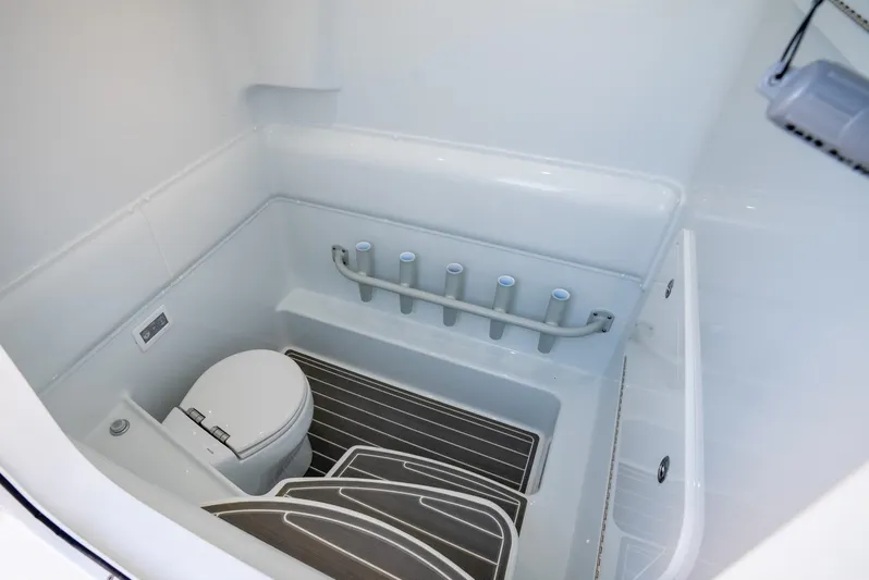  Yacht Photos Pics 2024 Yellowfin 39 boat interior bathroom with toilet and storage features.