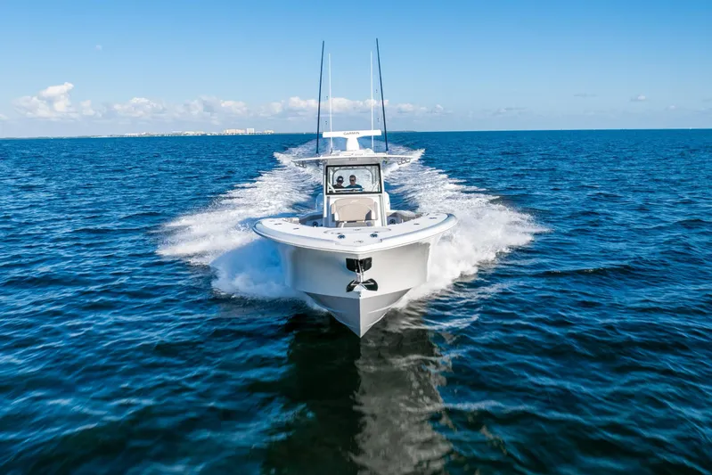  Yacht Photos Pics 2024 Yellowfin 39 boat cruising on open ocean waters.