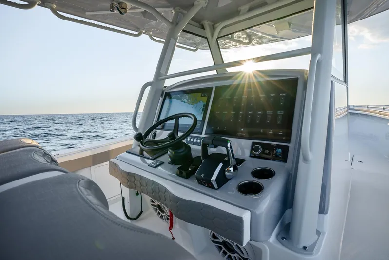  Yacht Photos Pics 2024 Yellowfin 39 boat dashboard with ocean view at sunset.