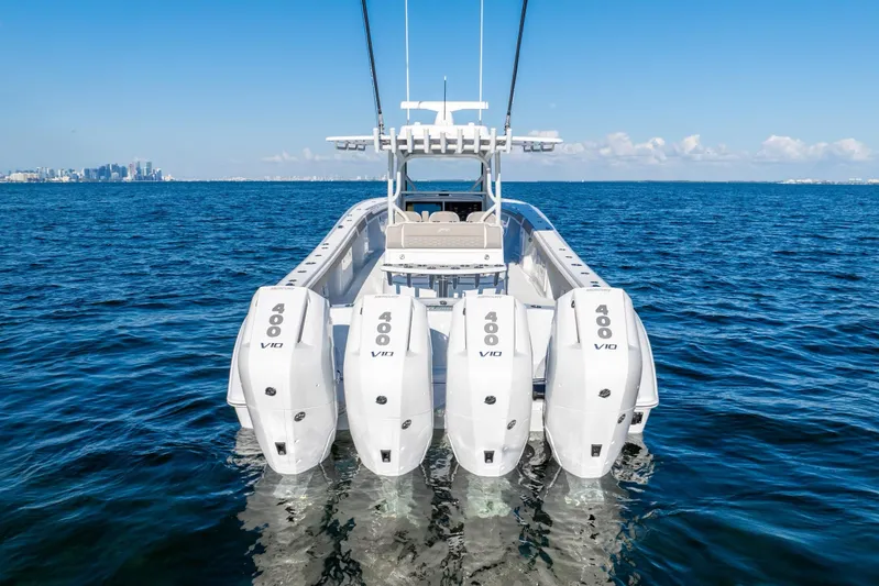  Yacht Photos Pics 2024 Yellowfin 39 boat with four powerful outboard engines on open water.