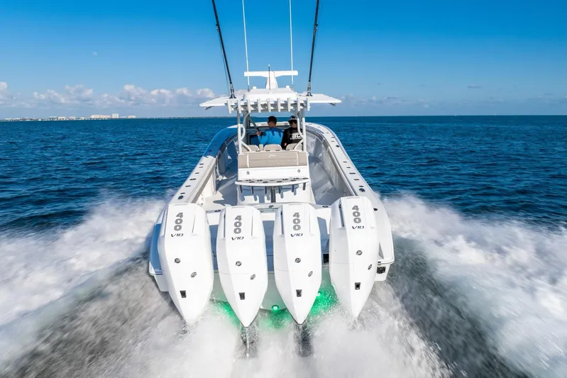  Yacht Photos Pics 2024 Yellowfin 39 boat with four powerful engines cruising on open water.