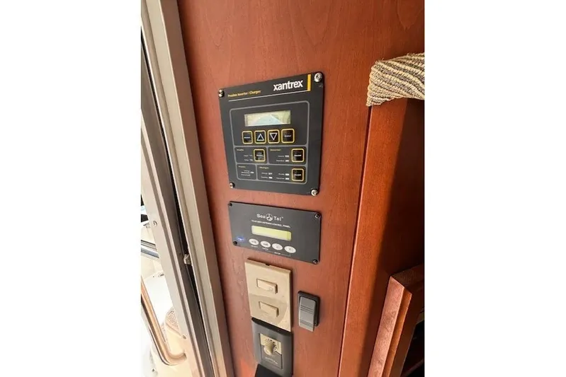 Stormer Yacht Photos Pics Control panel inside 2005 Silverton 34 Convertible boat, featuring Xantrex and Sea Tel systems.