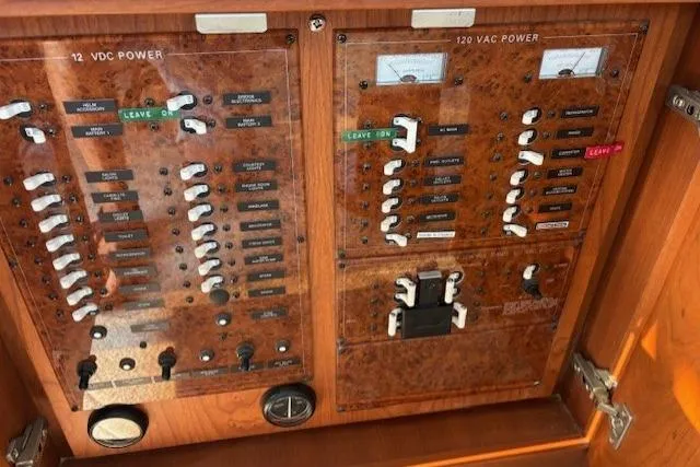 Stormer Yacht Photos Pics Electrical panel of a 2005 Silverton 34 Convertible boat, featuring 12 VDC and 120 VAC power controls.