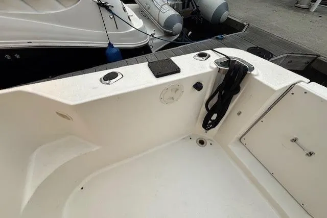 Stormer Yacht Photos Pics 2005 Silverton 34 Convertible boat deck with docked inflatable boats in background.