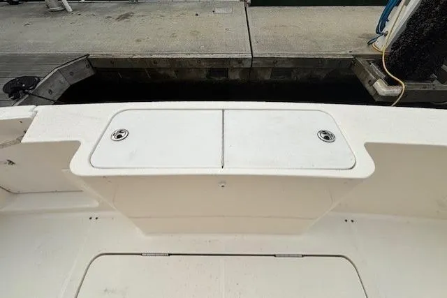 Stormer Yacht Photos Pics 2005 Silverton 34 Convertible boat deck at dockside, featuring storage compartments.