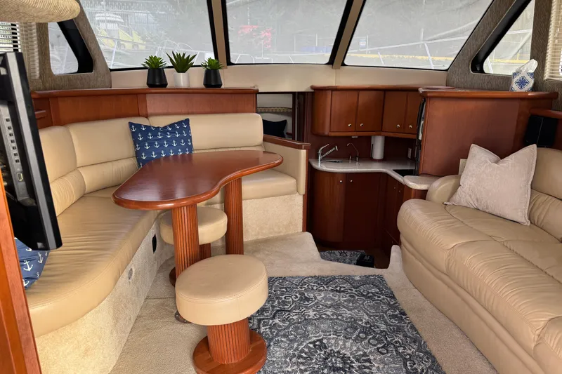 Stormer Yacht Photos Pics Luxurious interior of 2005 Silverton 34 Convertible yacht with plush seating and elegant decor.