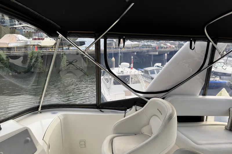 Stormer Yacht Photos Pics Interior view of a 2005 Silverton 34 Convertible yacht at a marina.