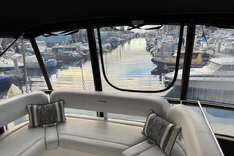 Stormer Yacht Photos Pics Interior view of 2005 Silverton 34 Convertible yacht overlooking marina.