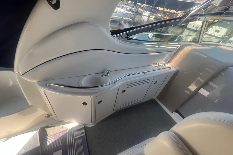  Yacht Photos Pics 2005 Sea Ray 360 Sundancer interior with sink and storage, docked at marina.