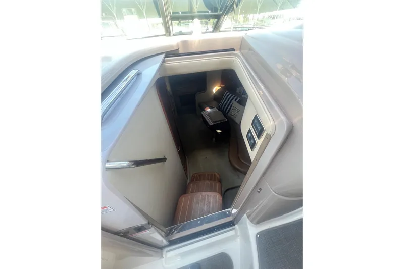  Yacht Photos Pics Interior view of 2005 Sea Ray 360 Sundancer cabin with seating and decor.