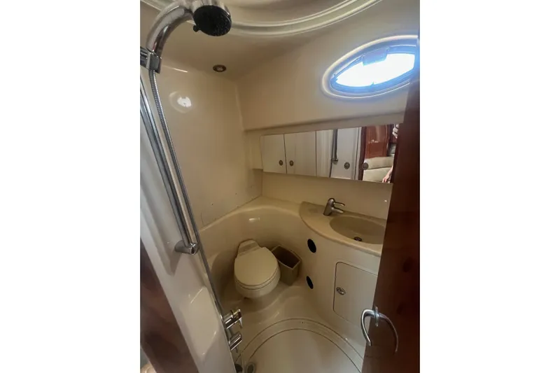  Yacht Photos Pics Bathroom interior of 2005 Sea Ray 360 Sundancer yacht, featuring shower and sink.
