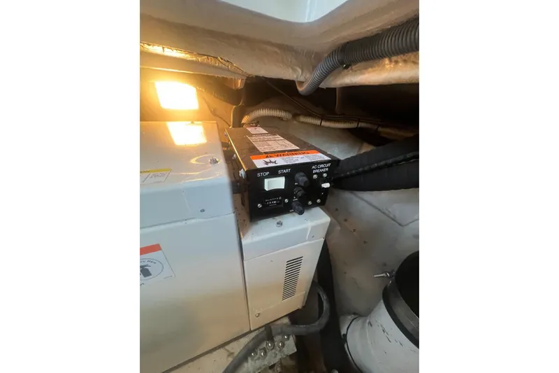  Yacht Photos Pics Engine compartment of 2005 Sea Ray 360 Sundancer with control panel and wiring.