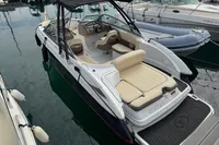 2007 Cobalt 232 boat docked, featuring beige seating and black canopy.
