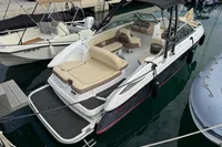 2007 Cobalt 232 boat docked, featuring beige seating and black canopy.
