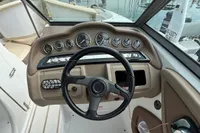 2007 Cobalt 232 boat dashboard with steering wheel and instrument panel.