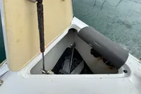 Open anchor compartment on 2007 Cobalt 232 boat, showing anchor and chain storage.