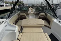 2007 Cobalt 232 boat interior with beige seating, docked at marina.