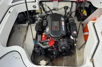 2007 Cobalt 232 boat engine compartment with visible engine components and safety equipment.