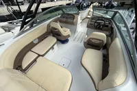 2007 Cobalt 232 boat interior with beige seating, docked at a marina.
