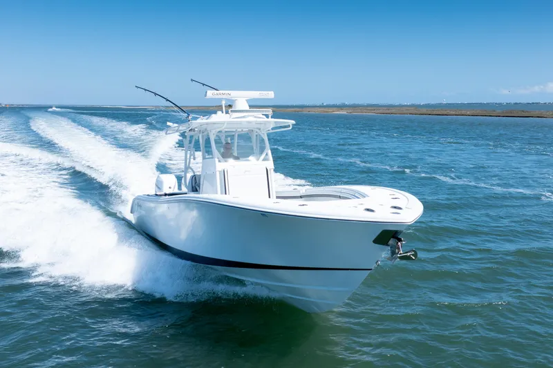  Yacht Photos Pics 2018 Yellowfin 32 Offshore boat cruising on open water.