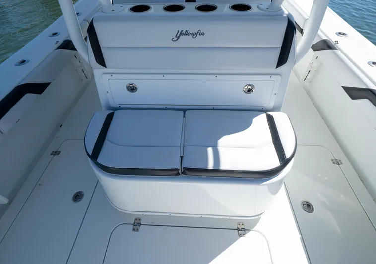  Yacht Photos Pics 2018 Yellowfin 32 Offshore boat interior with cushioned seating and storage compartments.