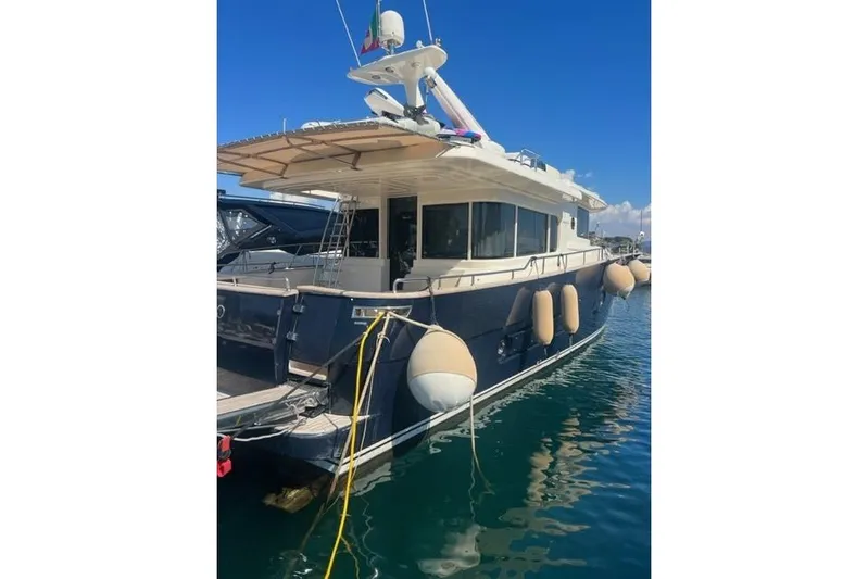  Yacht Photos Pics 2008 Apreamare Maestro 65 yacht docked in marina, featuring elegant design and spacious deck.