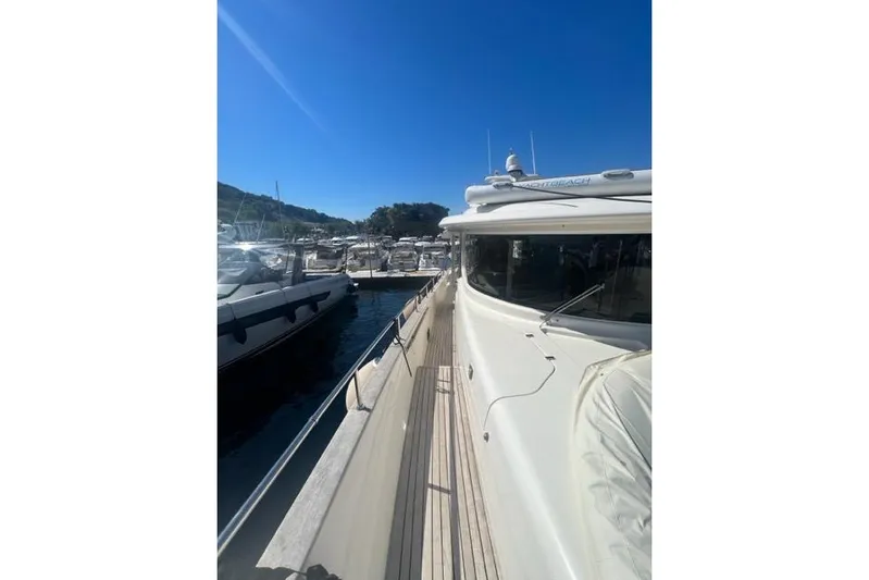  Yacht Photos Pics 2008 Apreamare Maestro 65 yacht docked in a sunny marina.