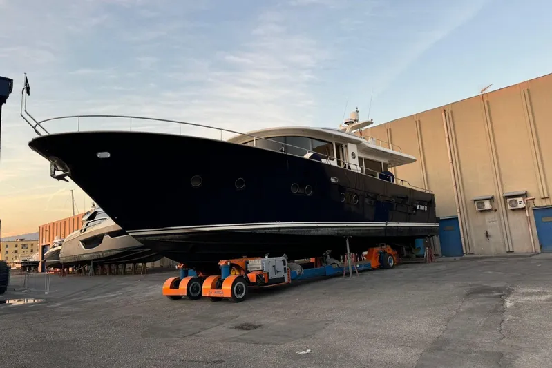  Yacht Photos Pics 2008 Apreamare Maestro 65 yacht on dry dock, showcasing sleek design and modern features.