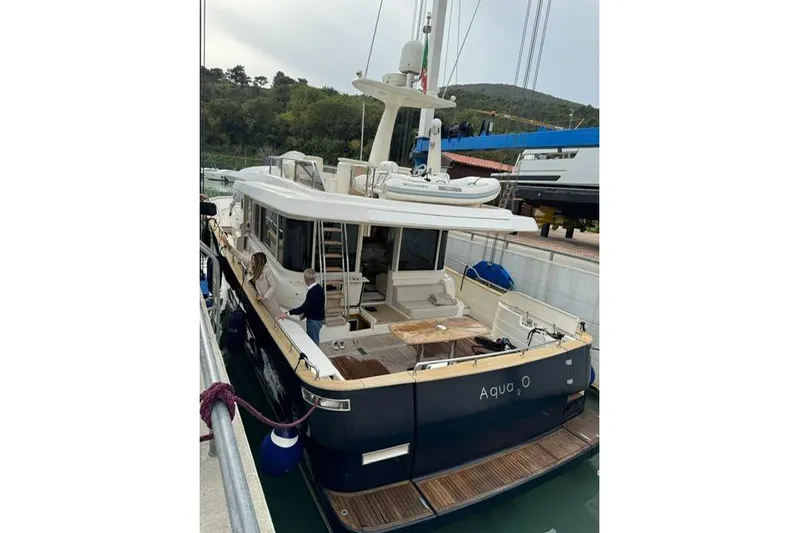  Yacht Photos Pics 2008 Apreamare Maestro 65 yacht docked, featuring spacious deck and modern design.