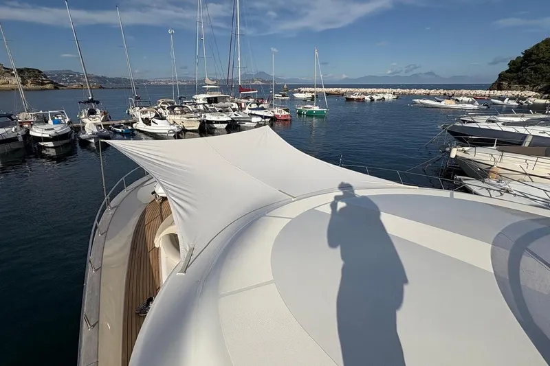  Yacht Photos Pics 2008 Apreamare Maestro 65 yacht docked in a scenic marina with clear skies.