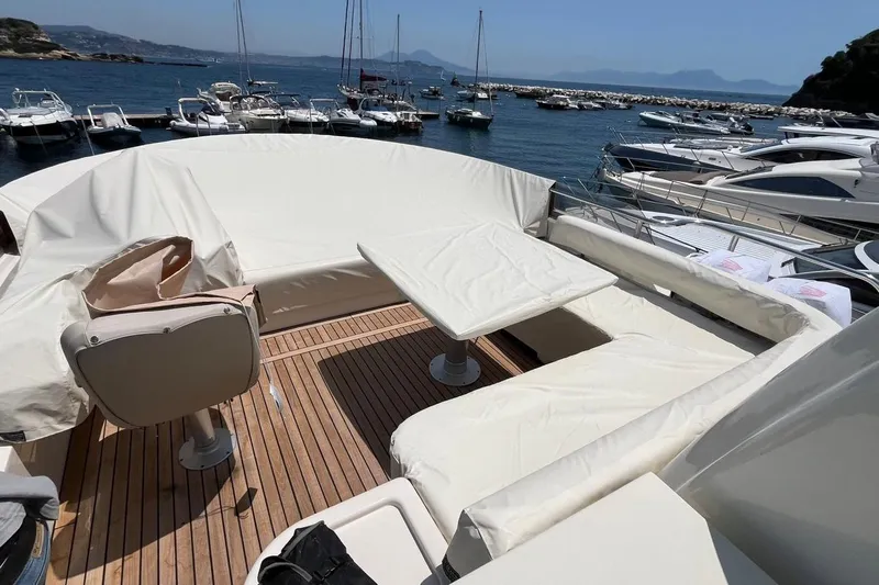 Yacht Photos Pics Luxury yacht Apreamare Maestro 65, 2008 model, with elegant deck seating and scenic marina view.