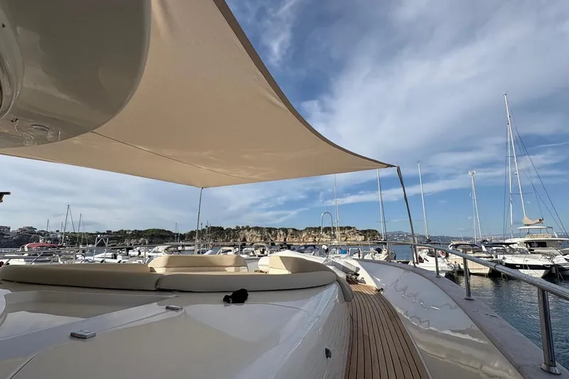  Yacht Photos Pics Luxurious 2008 Apreamare Maestro 65 yacht with sunshade, docked in a scenic marina.