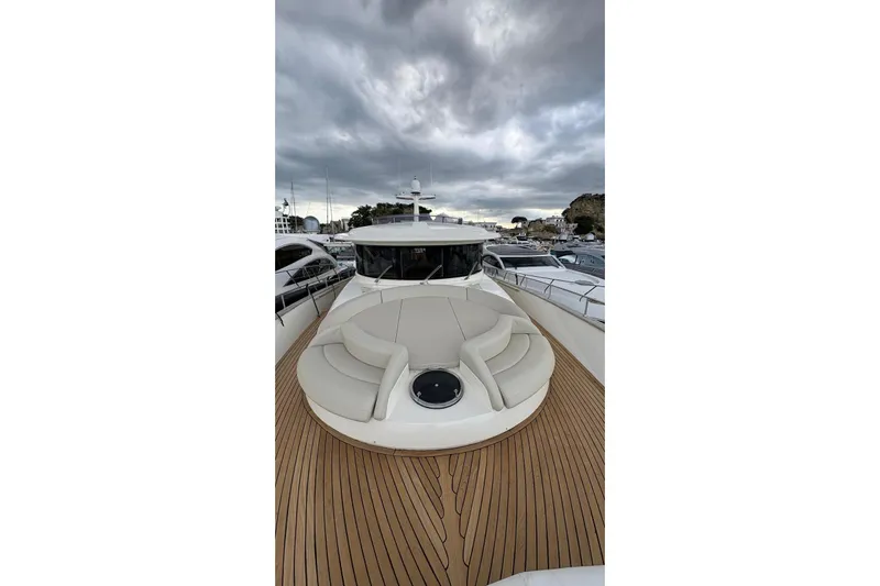  Yacht Photos Pics 2008 Apreamare Maestro 65 yacht with sleek deck and luxurious seating under cloudy skies.