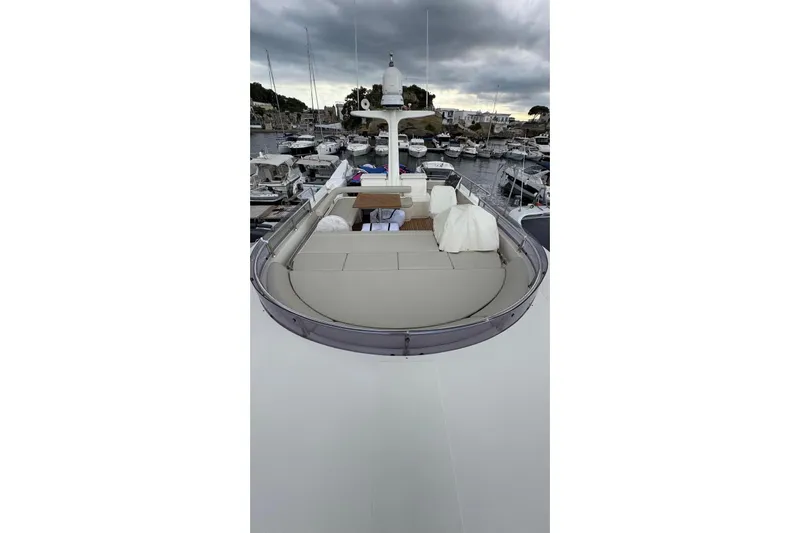  Yacht Photos Pics 2008 Apreamare Maestro 65 yacht docked in a marina under cloudy skies.