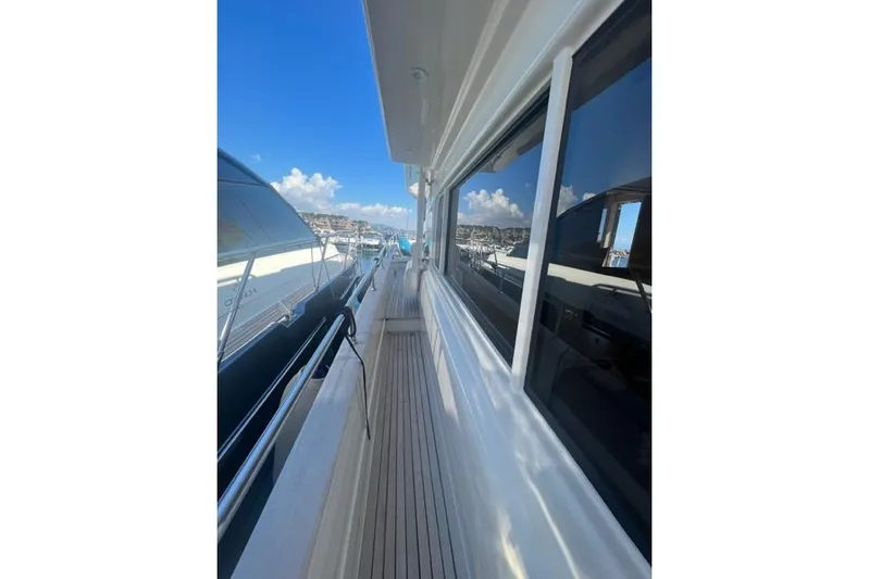  Yacht Photos Pics 2008 Apreamare Maestro 65 yacht deck with clear blue sky and marina view.