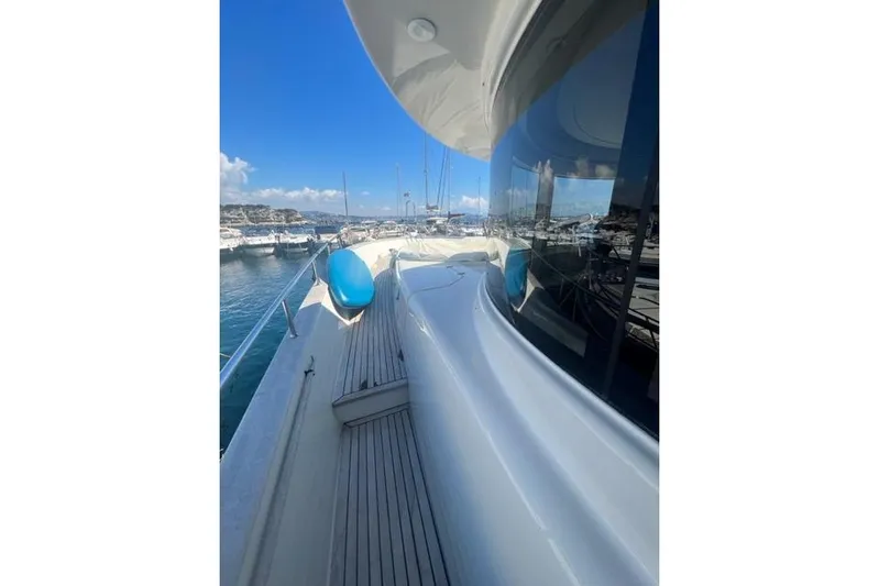  Yacht Photos Pics 2008 Apreamare Maestro 65 yacht docked at marina, showcasing sleek design and blue skies.